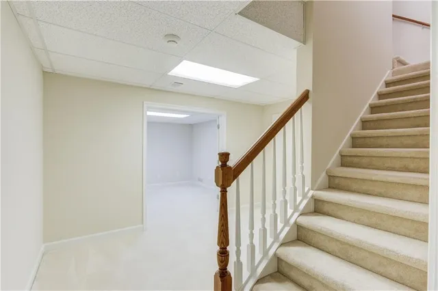 an aerial view of a house with a garden and swimming pool
