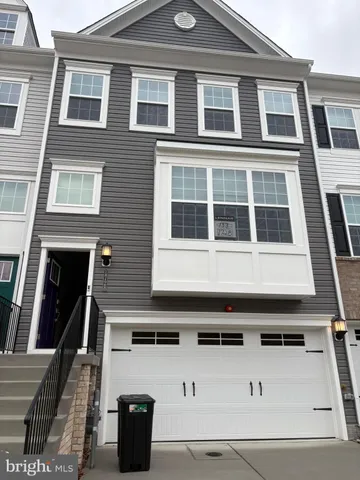 a front view of a building with many windows