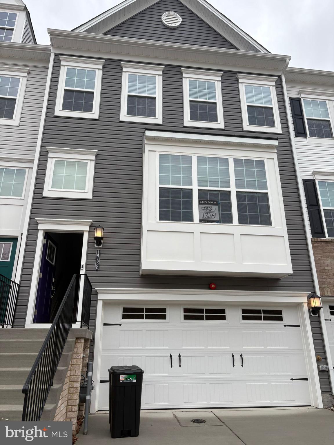1728 Water Xing Road Baltimore, MD 21208 - Photo 1 of 13 a front view of a building with many windows