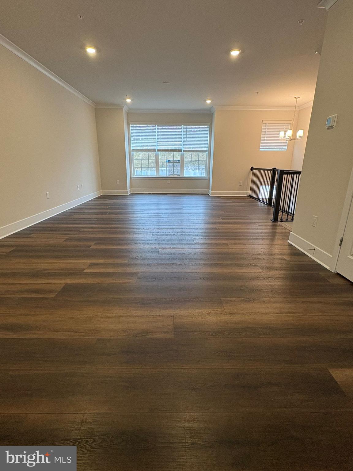 1728 Water Xing Road Baltimore, MD 21208 - Photo 6 of 13 a view of an empty room with wooden floor