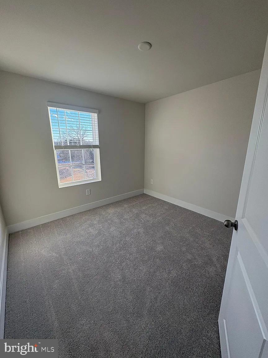 1728 Water Xing Road Baltimore, MD 21208 - Photo 10 of 13 an empty room with a window