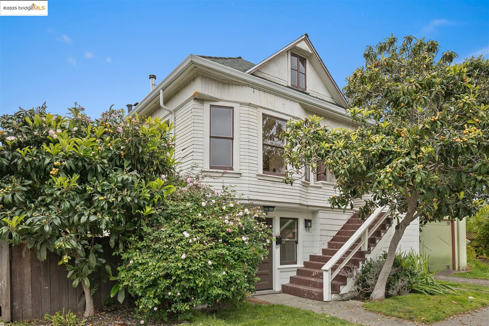 1406 Kains Avenue Berkeley, CA 94702 - Photo 1 of 1 a view of a house with a yard