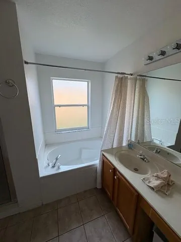 a bathroom with a sink and a bathtub