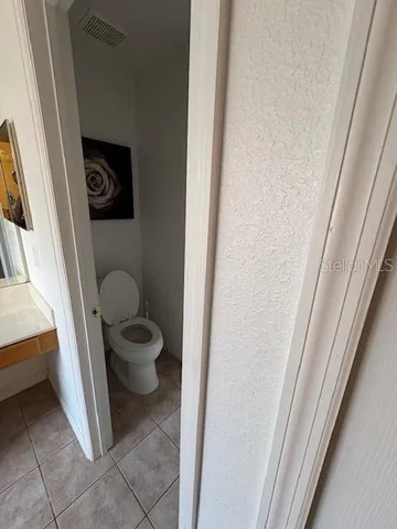 a bathroom with a toilet and a sink