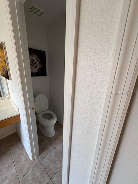 8410 Secret Key Cove Kissimmee, FL 34747 - Photo 20 of 41 a bathroom with a toilet and a sink