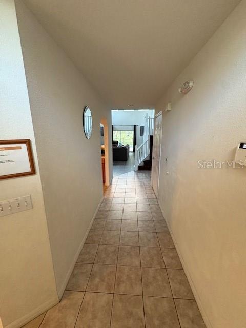8410 Secret Key Cove Kissimmee, FL 34747 - Photo 2 of 41 a view of a hallway with wooden floor and a bathroom