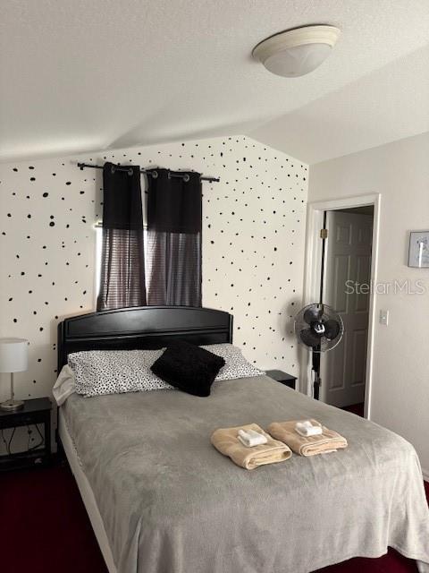 8410 Secret Key Cove Kissimmee, FL 34747 - Photo 24 of 41 a bedroom with a bed and a painting on the wall