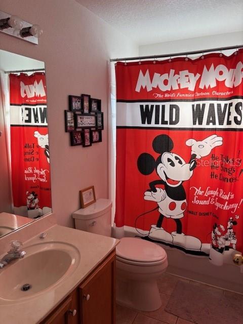 8410 Secret Key Cove Kissimmee, FL 34747 - Photo 30 of 41 a bathroom with a sink a toilet and shower curtain