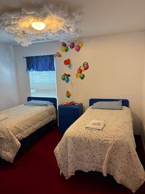 8410 Secret Key Cove Kissimmee, FL 34747 - Photo 31 of 41 a bedroom with a bed and painting on the wall