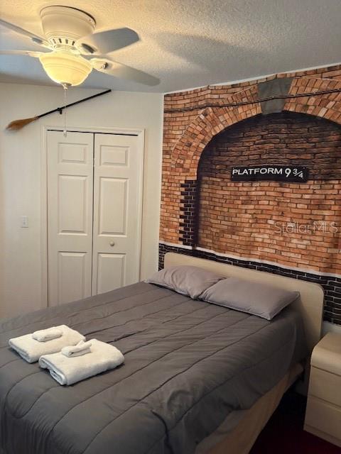 8410 Secret Key Cove Kissimmee, FL 34747 - Photo 34 of 41 a bedroom with a bed and a chandelier