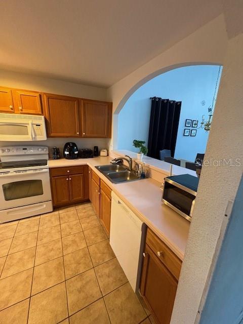 8410 Secret Key Cove Kissimmee, FL 34747 - Photo 5 of 41 a kitchen with stainless steel appliances a stove top oven a sink a counter top space and cabinets