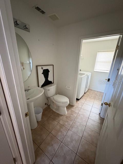 8410 Secret Key Cove Kissimmee, FL 34747 - Photo 10 of 41 a bathroom with a toilet and a shower