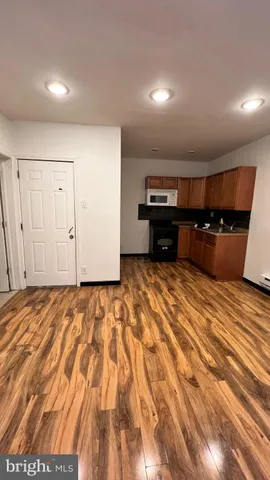 a view of a livingroom with wooden floor