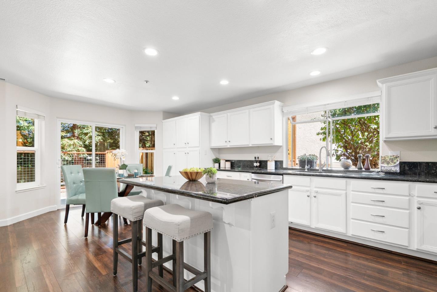 205 Sidesaddle Circle Scotts Valley, CA 95066 - Photo 12 of 57 a kitchen with granite countertop white cabinets and chairs