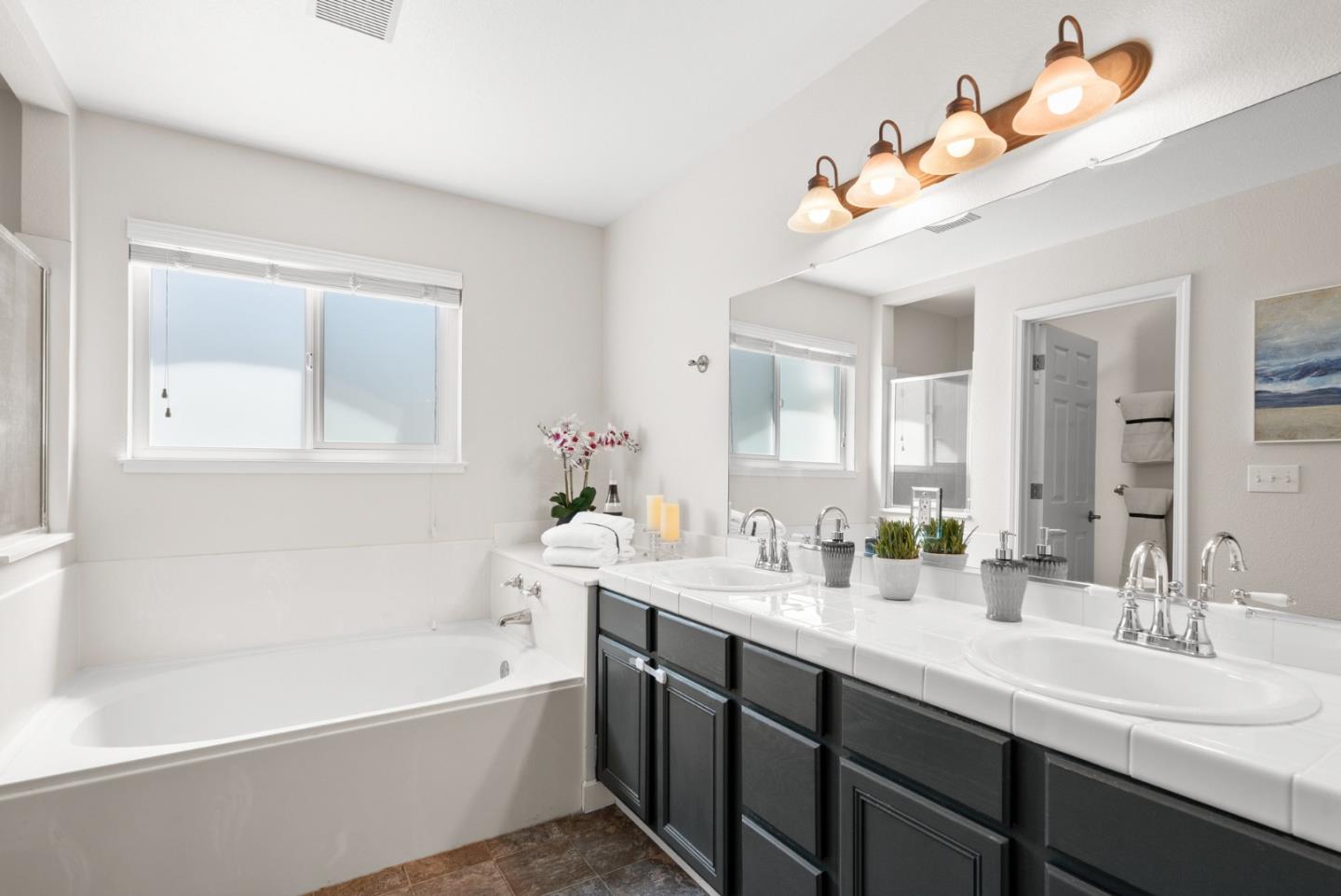 205 Sidesaddle Circle Scotts Valley, CA 95066 - Photo 33 of 57 a bathroom with a double vanity sink mirror and bathtub
