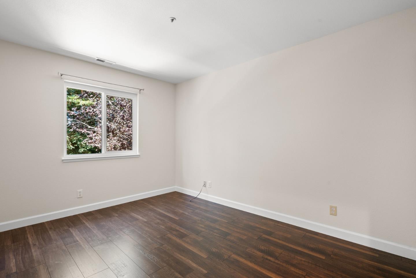 205 Sidesaddle Circle Scotts Valley, CA 95066 - Photo 35 of 57 an empty room with wooden floor and window