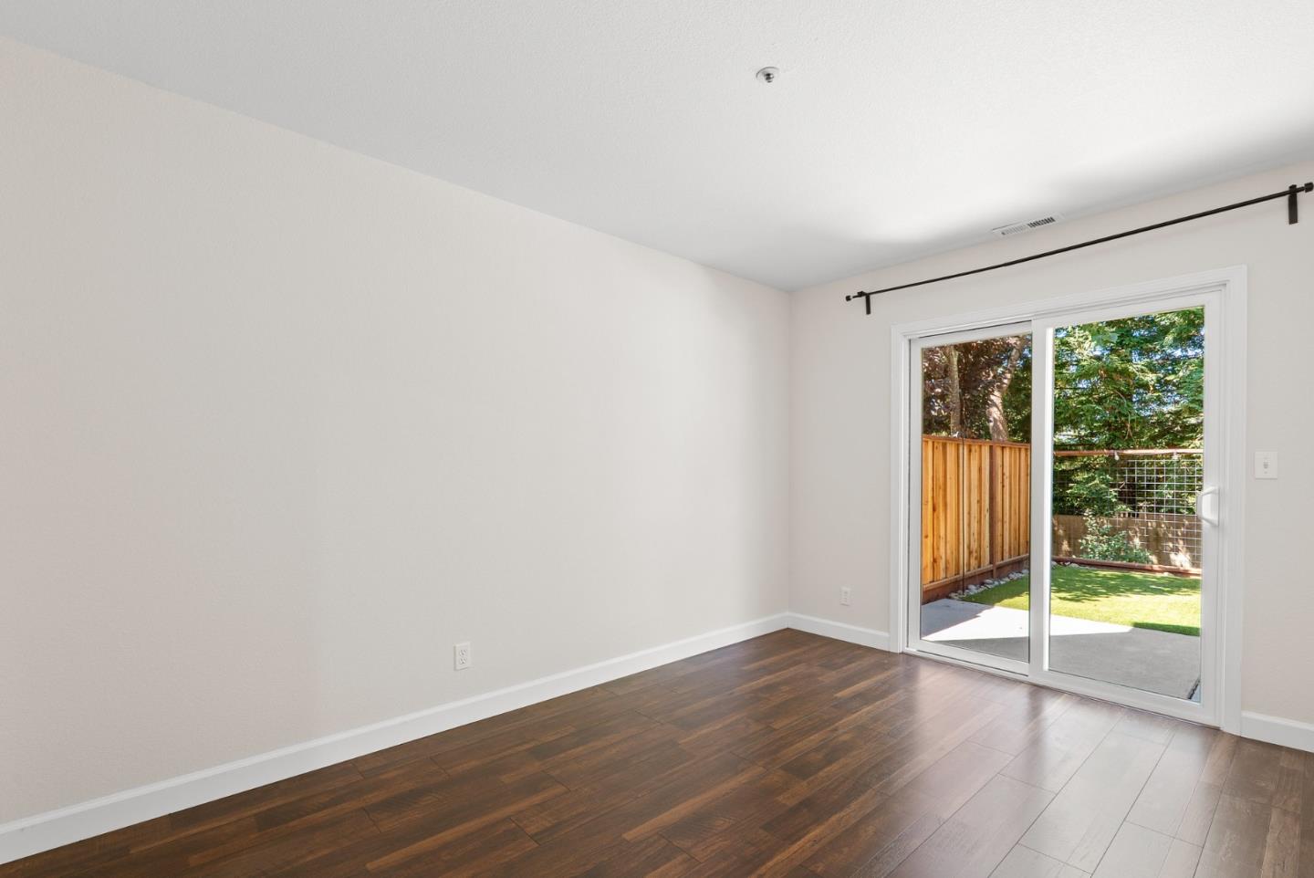 205 Sidesaddle Circle Scotts Valley, CA 95066 - Photo 39 of 57 a view of an empty room with wooden floor and a window