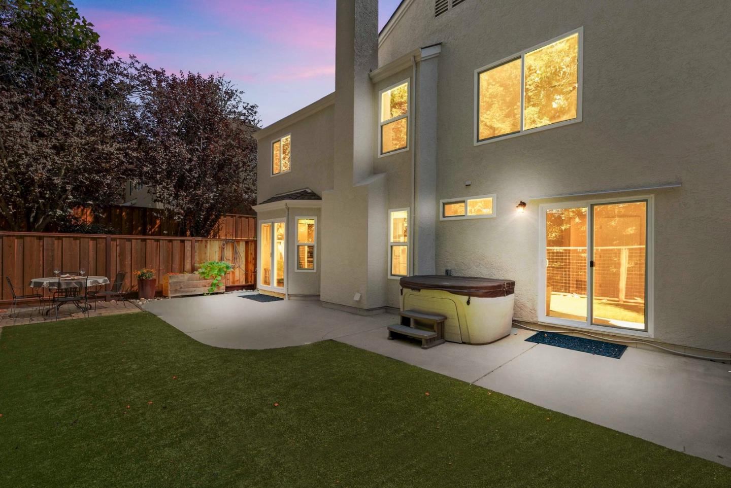 205 Sidesaddle Circle Scotts Valley, CA 95066 - Photo 45 of 57 a view of a backyard with table and chairs potted plants and wooden fence