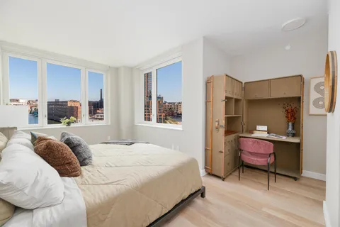 a bedroom with a bed and window