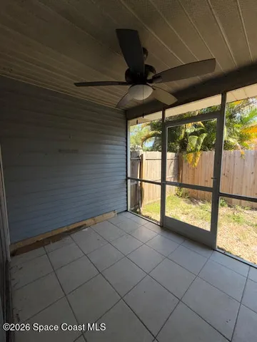 a view of an empty room with a large window