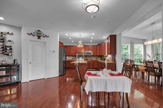 a view of a porch with furniture and wooden floor