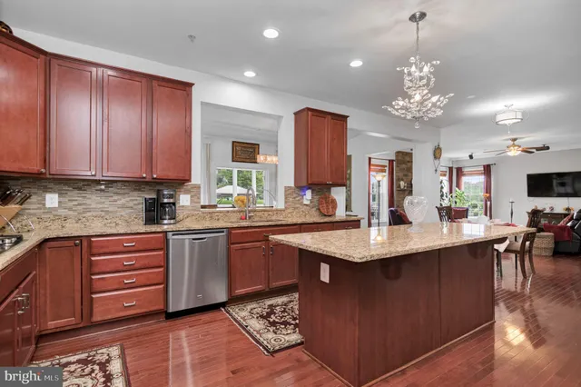 a bed room with a bed a television and a window