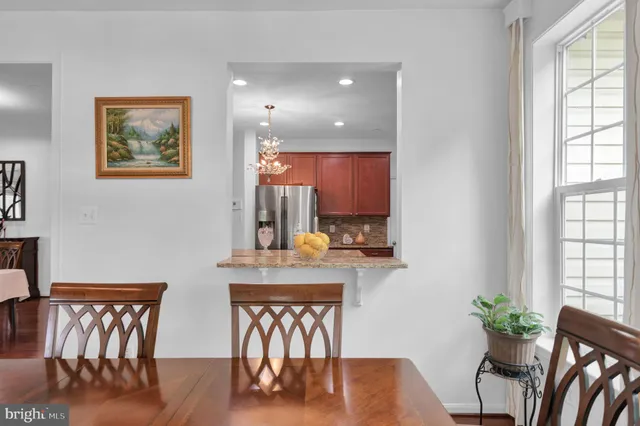 a bathroom with a tub a sink and a mirror