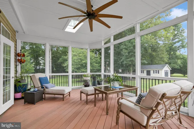 a bathroom with a granite countertop sink and a bathtub