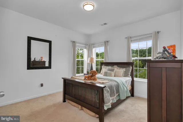 a view of a bathroom with a shower and a window