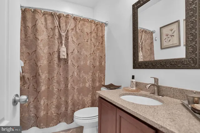 a front view of a house with a yard and outdoor seating