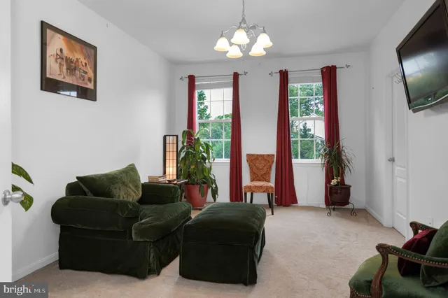a view of a house with backyard sitting area and garden