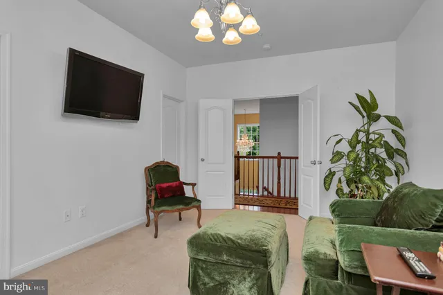 a front view of a house with a yard table and chairs
