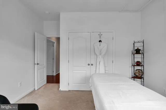 a view of a patio with a table and chairs under an umbrella