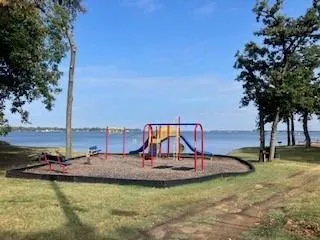 a view of a swimming pool with a yard