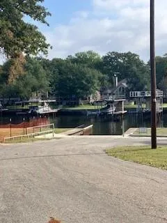 a view of a swimming pool with a lake view