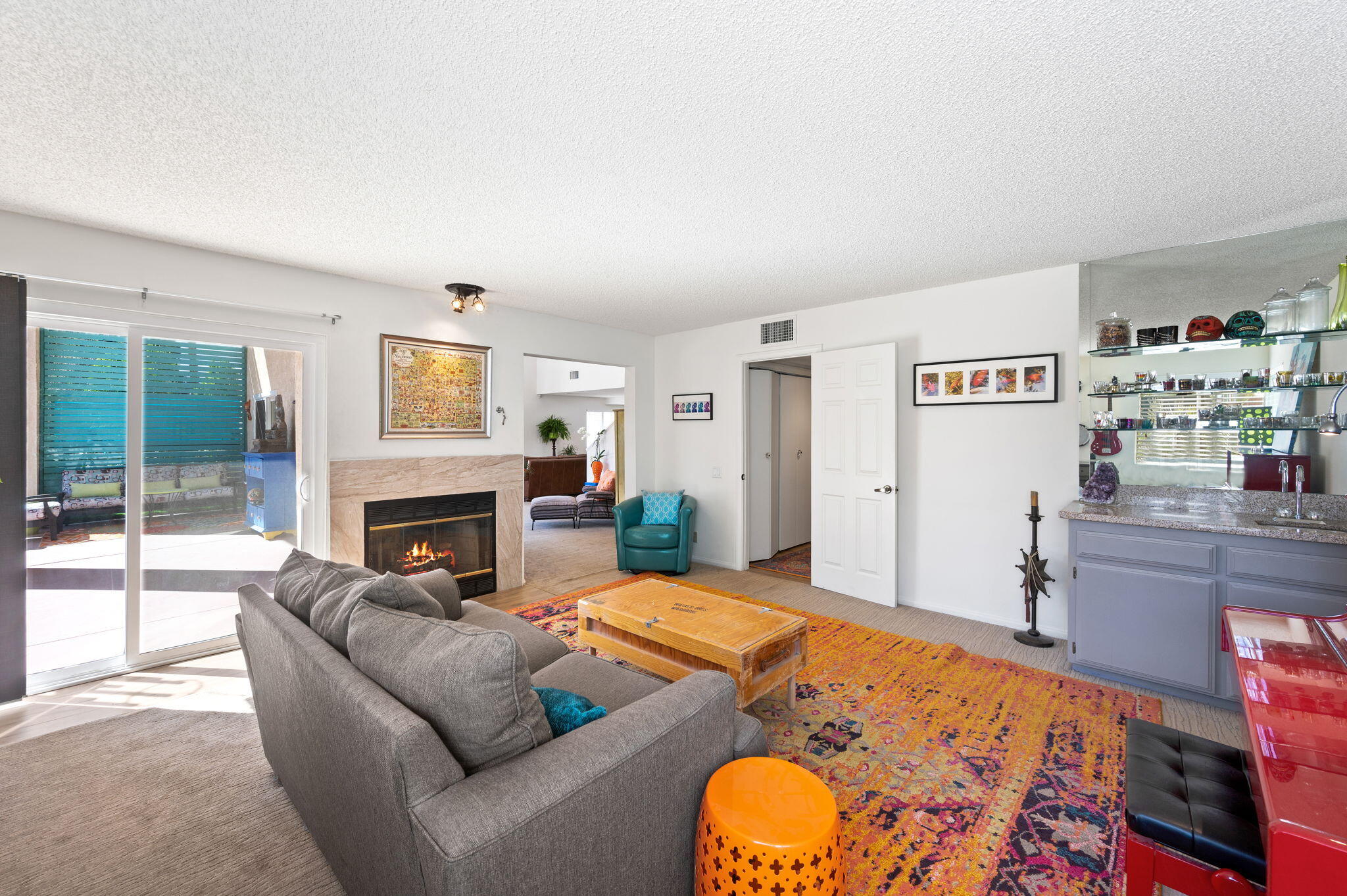68237 Risueno Road Cathedral City, CA 92234 - Photo 13 of 34 a living room with furniture and a fireplace