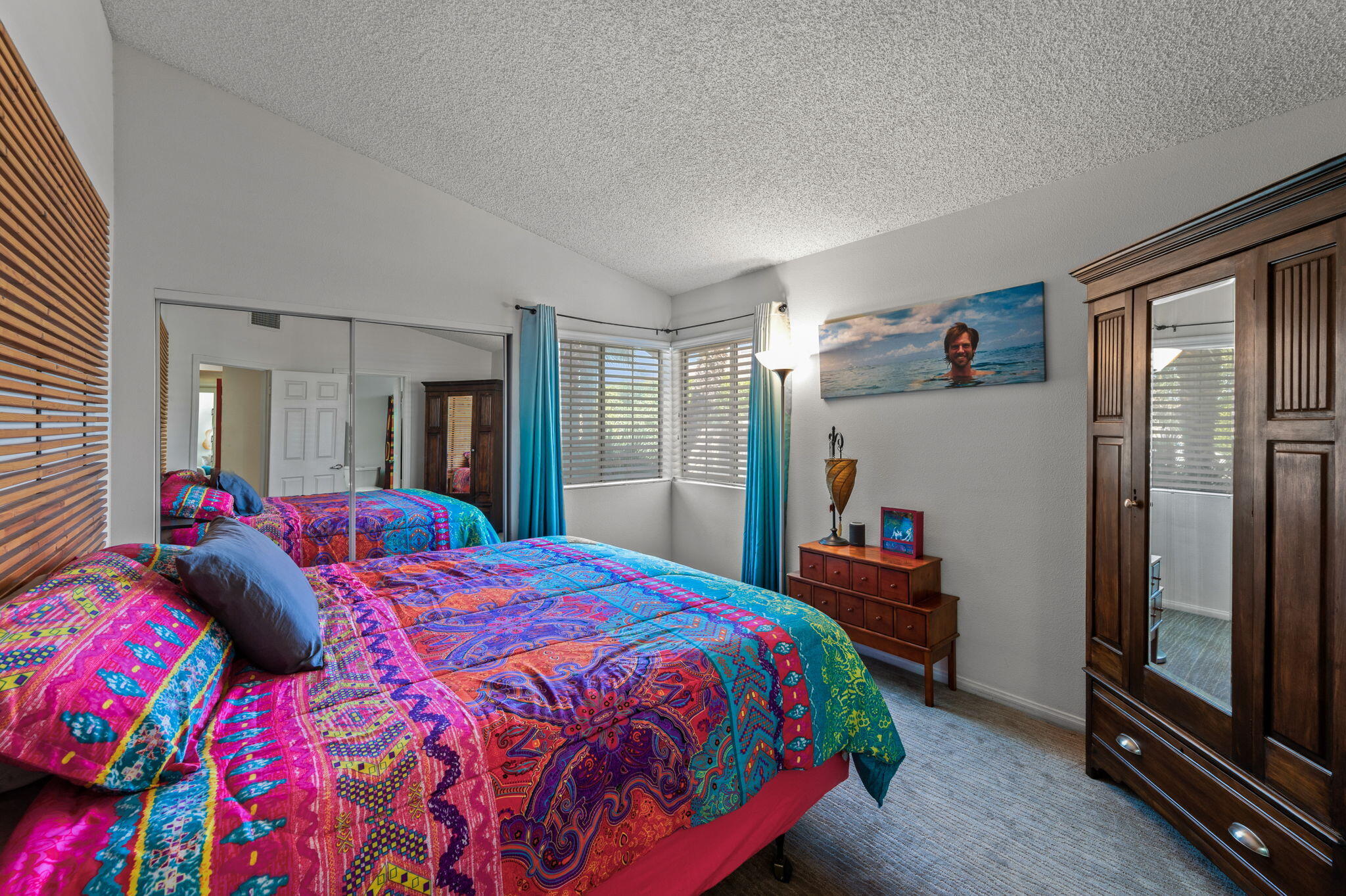 68237 Risueno Road Cathedral City, CA 92234 - Photo 14 of 34 a bedroom with a bed closet and a large window