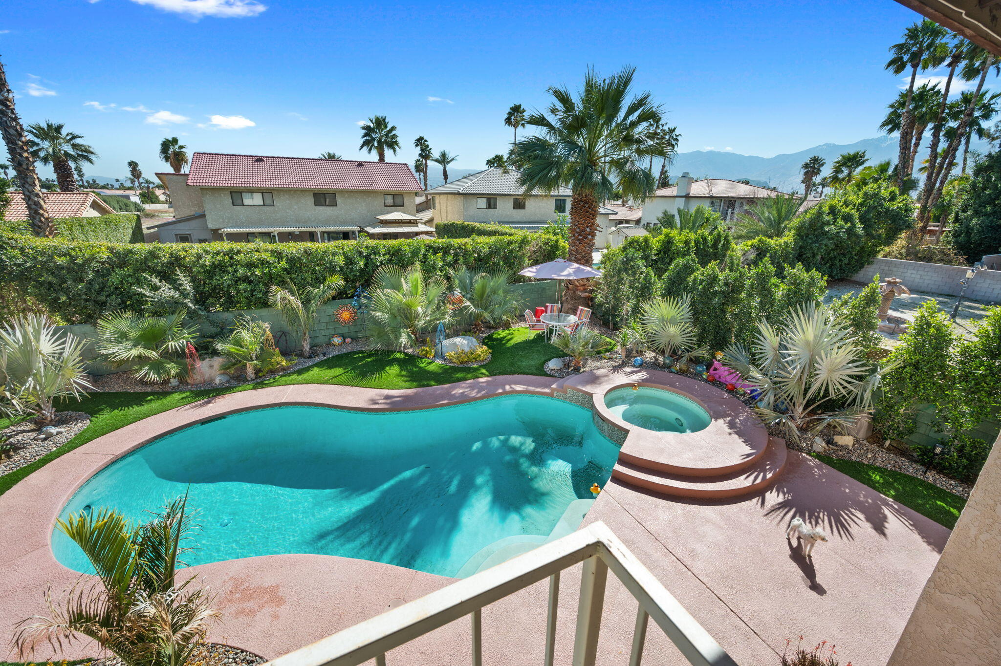 68237 Risueno Road Cathedral City, CA 92234 - Photo 24 of 34 a view of a swimming pool with a patio