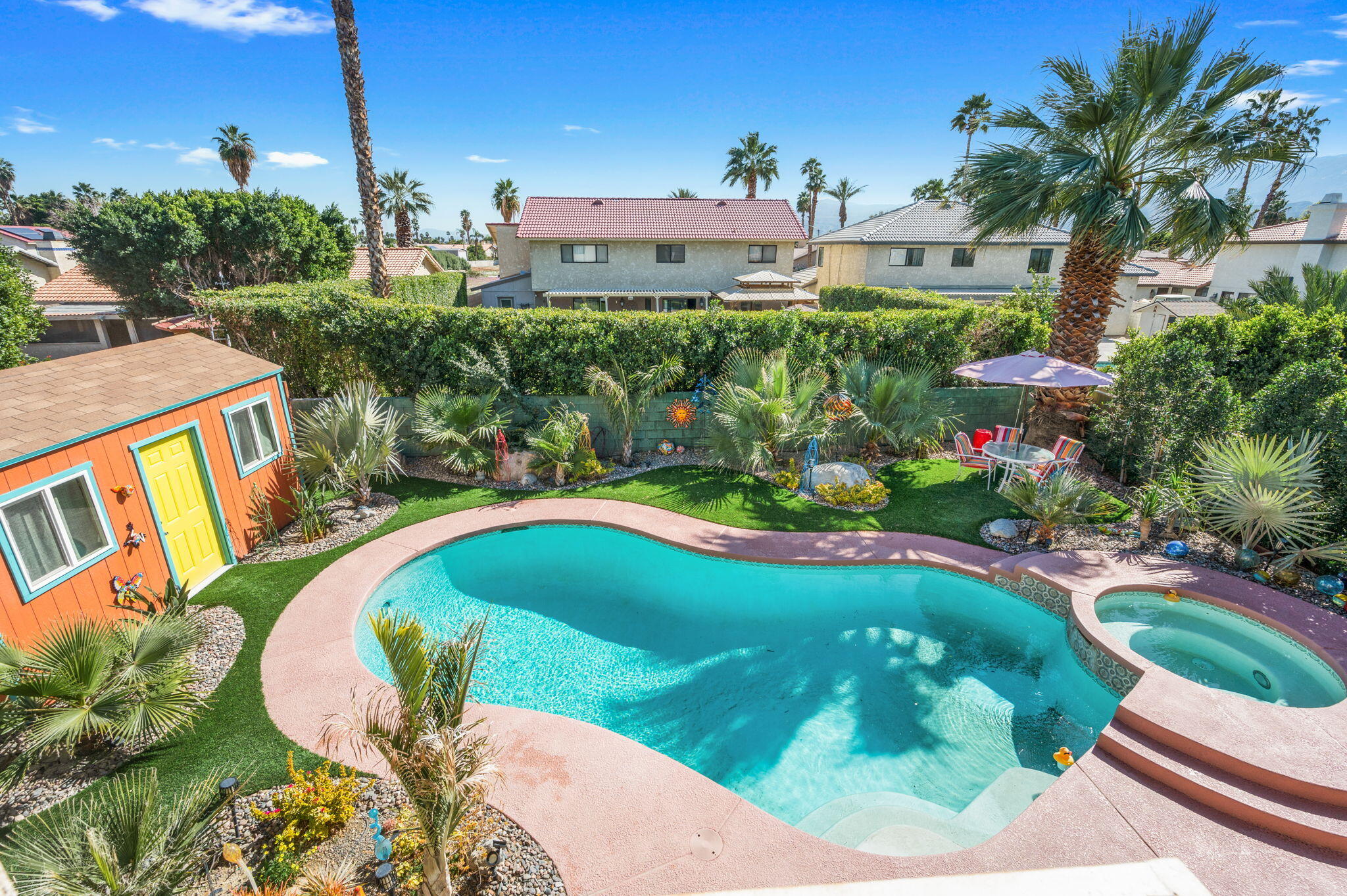 68237 Risueno Road Cathedral City, CA 92234 - Photo 25 of 34 a view of a swimming pool with a yard