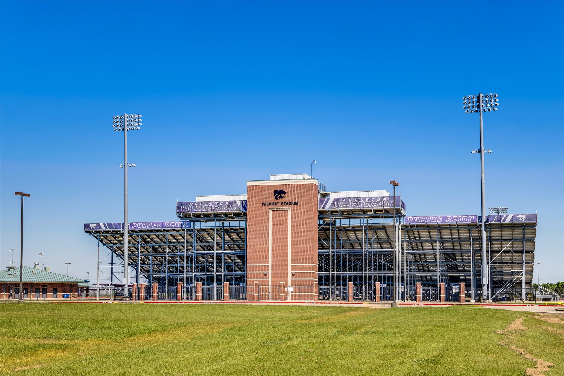 216 Amy Street Angleton, TX 77515 - Photo 8 of 36 a view of a large building with a big yard