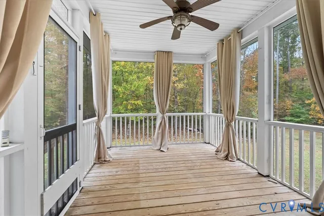 a view of a room with wooden floor and balcony
