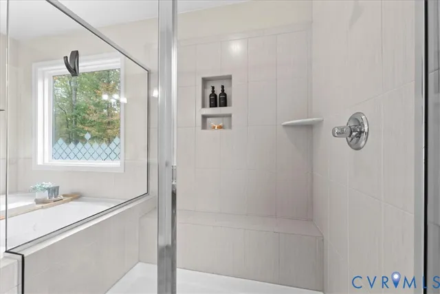 a bathroom with a bathtub and a sink