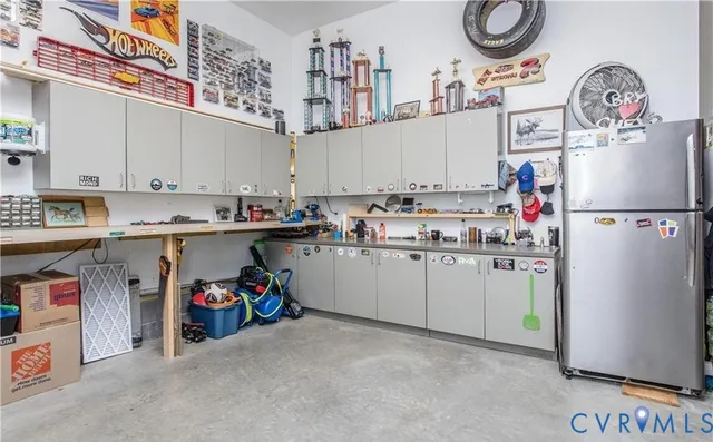 a utility room with cabinets dryer and washer
