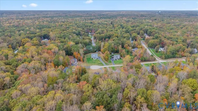 a aerial view of a house with a yard