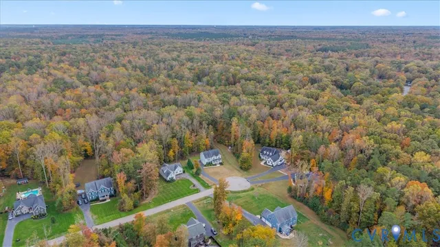 a view of a field with an ocean and mountain view