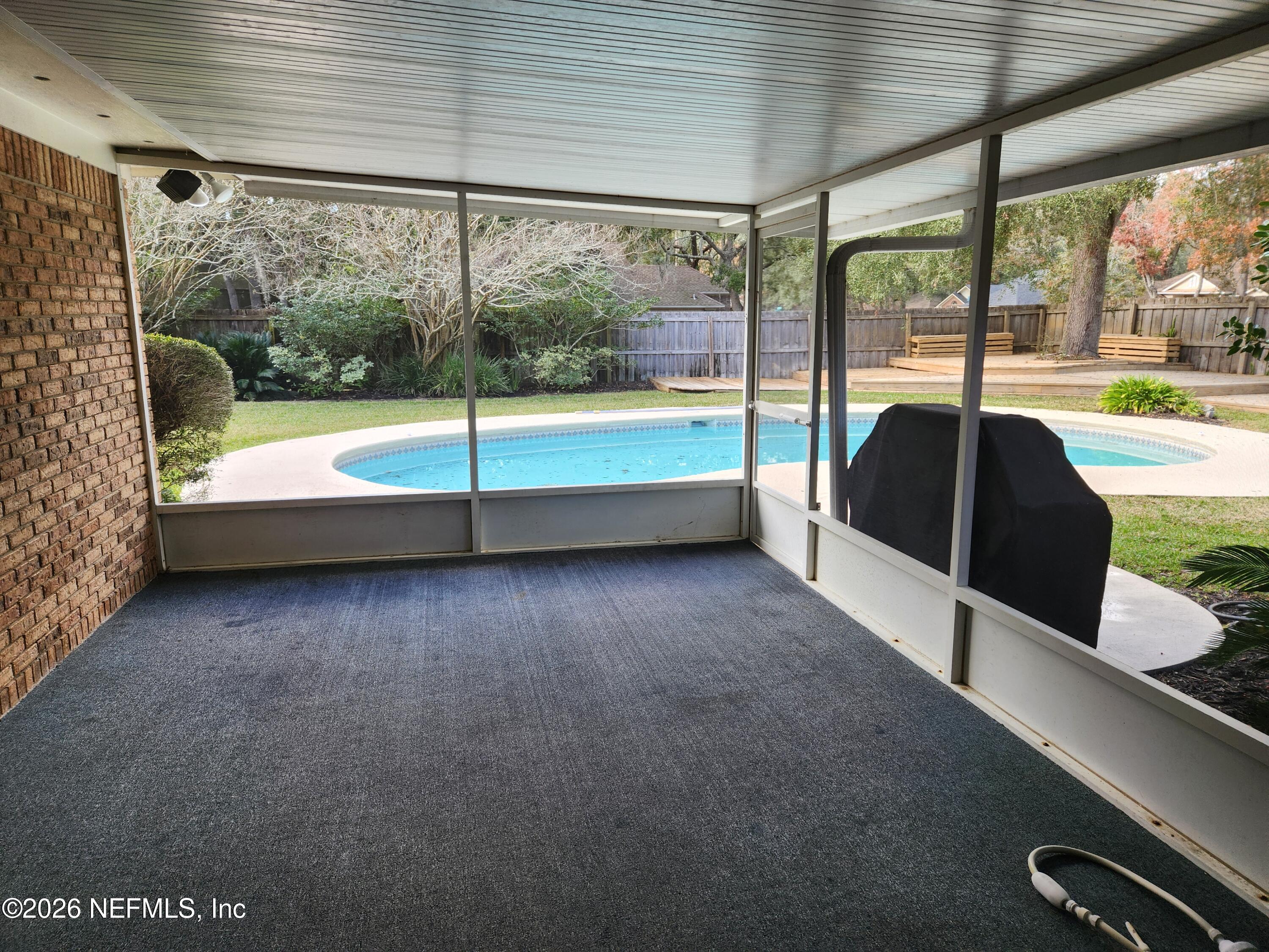 1424 Panther Run Road Jacksonville, FL 32225 - Photo 11 of 36 a view of a large room with large windows