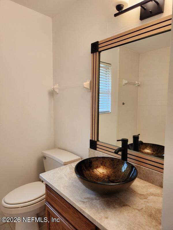 1424 Panther Run Road Jacksonville, FL 32225 - Photo 28 of 36 a bathroom with a toilet and a sink