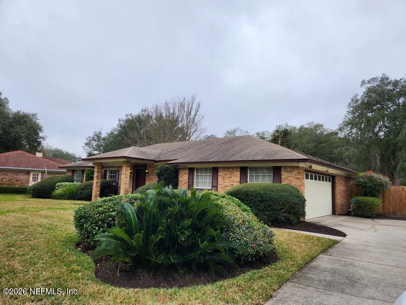 1424 Panther Run Road Jacksonville, FL 32225 - Photo 3 of 36 a front view of a house with a garden