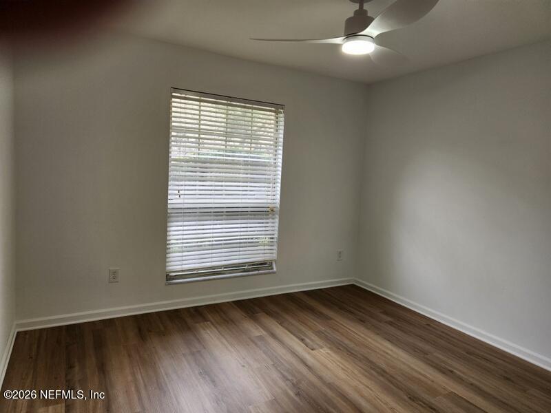 1424 Panther Run Road Jacksonville, FL 32225 - Photo 31 of 36 an empty room with wooden floor and windows