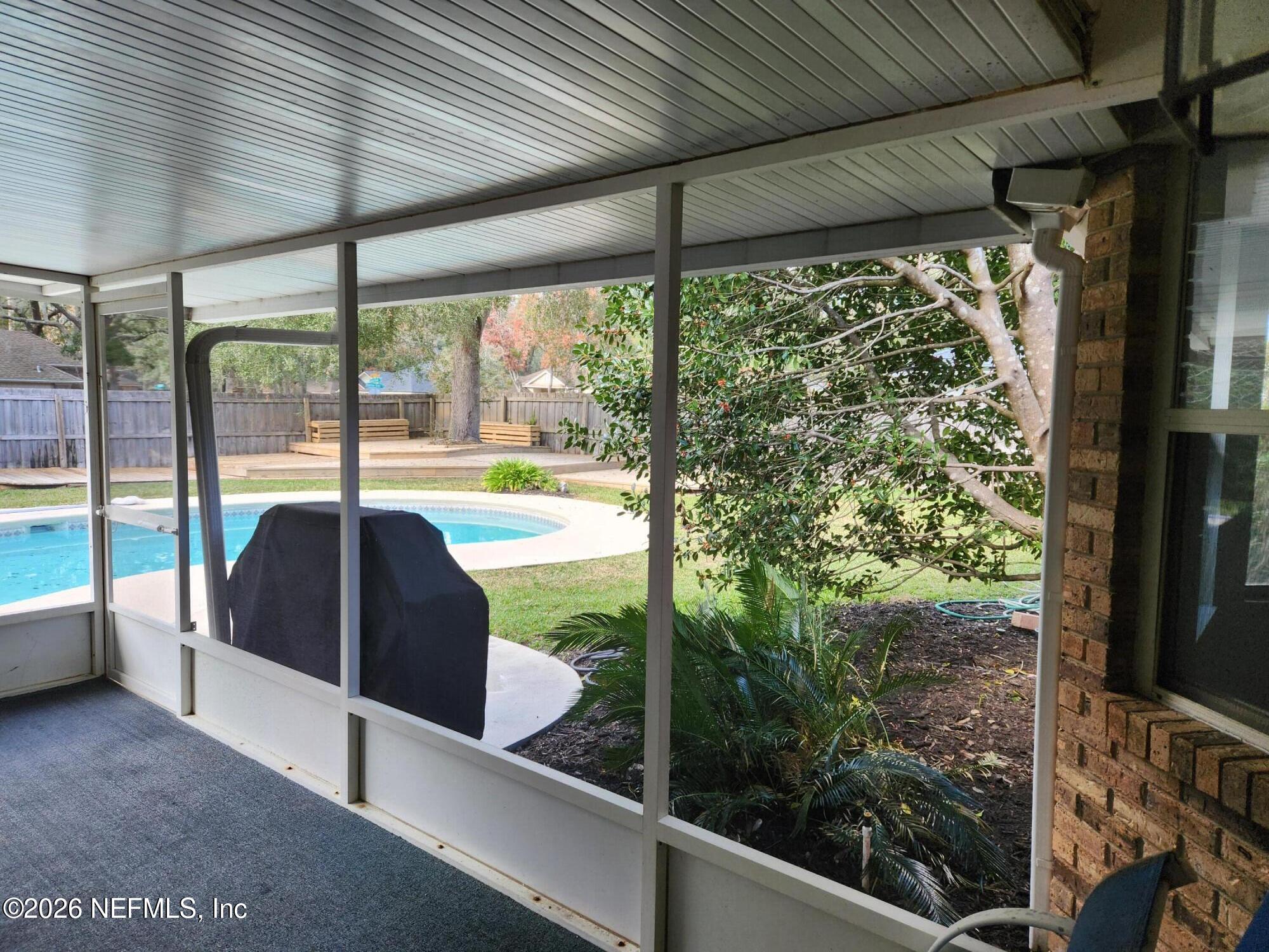 1424 Panther Run Road Jacksonville, FL 32225 - Photo 10 of 36 a view of a lot of large windows and a table